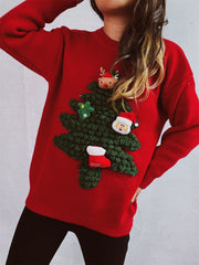 Red acrylic knit sweater with a 3D Christmas tree applique featuring Santa, reindeer, star, and stocking details.