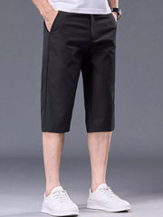 Men's black chino shorts with pockets and belt loops.