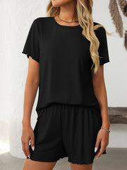 Black ribbed lounge set with raw edge trim on t-shirt and shorts