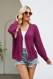 Openwork knit button-down cardigan in cerise with a V-neck and long sleeves.