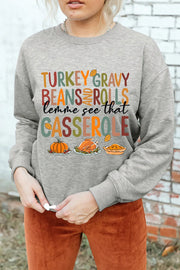 Gray graphic sweatshirt with Thanksgiving food print and text.