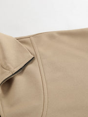 Camel quarter zip top detail with zipper and stitching