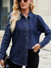 Dark blue denim blouse with ruffled puff sleeves and button front.