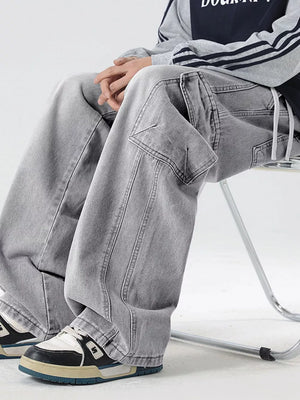 Light gray oversized cargo jeans with drawstring waist and utility pockets.
