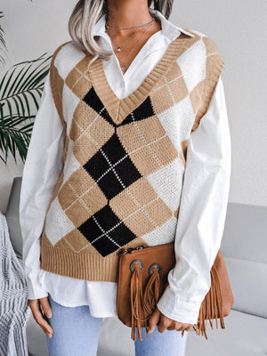 Argyle knit sweater vest in tan, white, and black with V-neck.