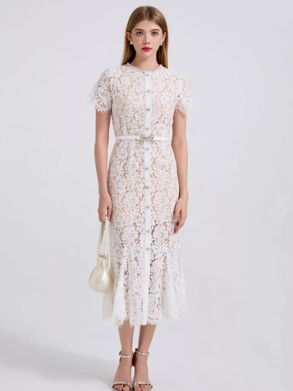 White floral lace mermaid dress with short sleeves, button front, and embellished belt.