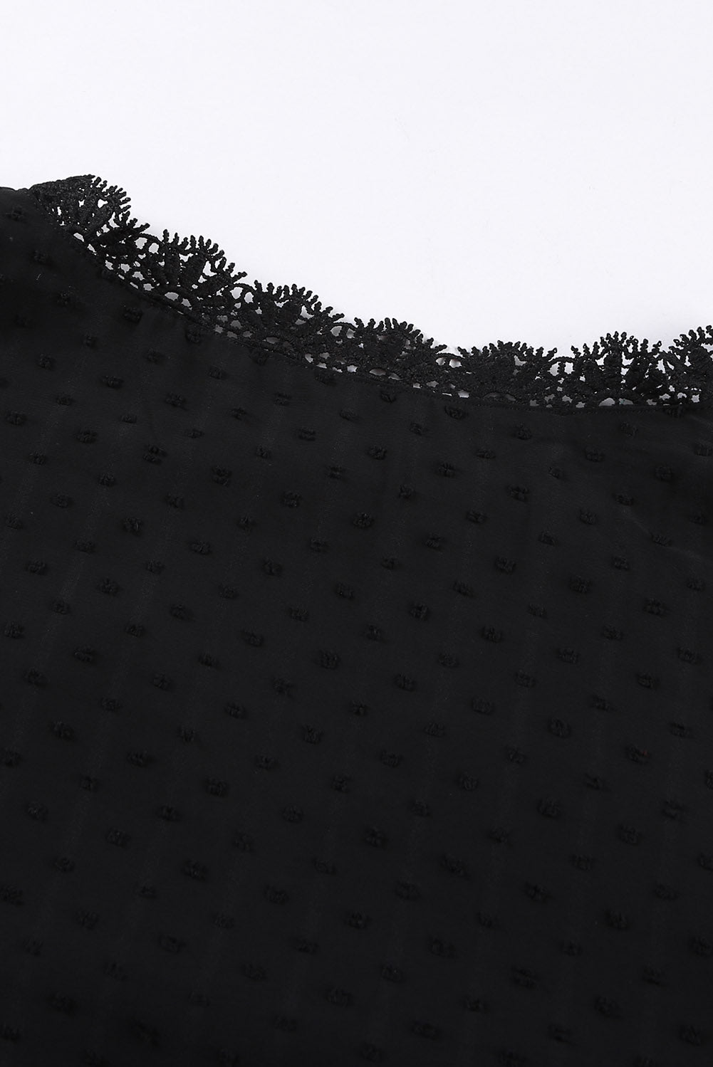 Black textured dot blouse with delicate lace trim detail at the neckline.