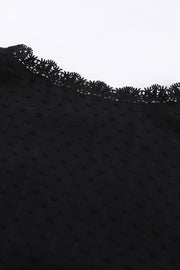 Black textured dot blouse with delicate lace trim detail at the neckline.