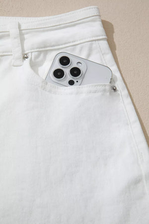 White denim jeans with a phone in the pocket
