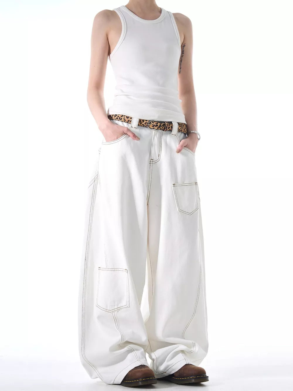 White cotton wide-leg jeans with contrast stitching and functional pockets.
