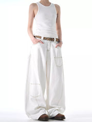 White cotton wide-leg jeans with contrast stitching and functional pockets.