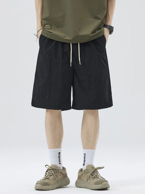 Black casual drawstring shorts with white sporty stripes and side pockets.