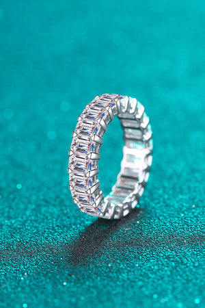 Emerald cut eternity band ring in silver with baguette stones