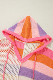 Colorblock knit hoodie with crochet panels and drawstring hood in pink, orange, purple, and beige stripes.