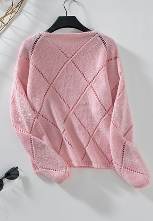 Blush pink knit sweater with diamond cutwork and sequin sleeves.