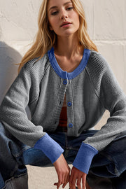Dark Gray raglan sleeve cardigan with contrast Indigo trim and buttons.