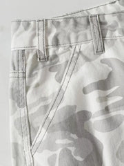 Men's utility cargo pants in white and grey camouflage pattern, featuring contrast stitching and belt loops.