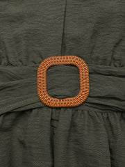 Bohemian maxi dress in olive green with a woven buckle detail and tiered skirt.