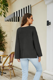 Black relaxed fit V-neck knit pullover sweater with ribbed cuffs and hem.