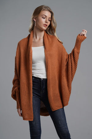 Cocoon knit sleeve cardigan in Terracotta acrylic with open front and wide sleeves.
