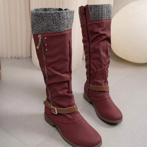 Burgundy suede slouch knee-high boots with knit cuff and side zipper detail.