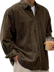 Men's brown corduroy button-up shirt with a classic fit and visible buttons.