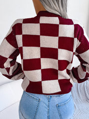 Checkerboard knit mock neck pullover sweater in burgundy and cream acrylic.