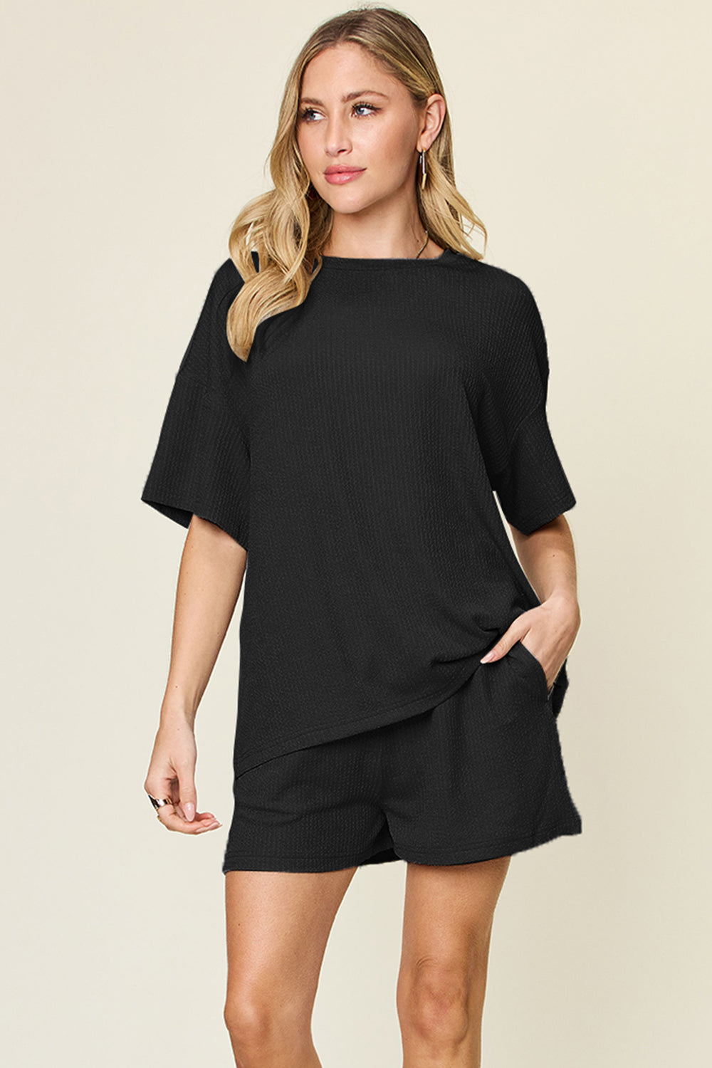 Black waffle knit boxy tee and shorts set with crew neck and short sleeves.