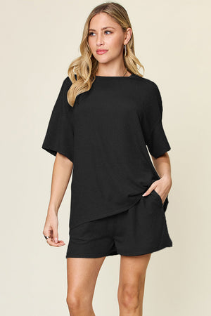 Black waffle knit boxy tee and shorts set with crew neck and short sleeves.