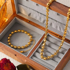 Gold 18K gold-plated bracelet with sculpted orb chain links and extender.