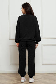 Black corduroy loungewear set with crew neck sweatshirt and jogger pants