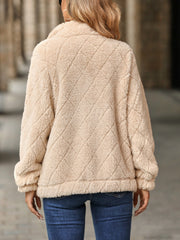 Tan textured teddy zip-up jacket with diamond quilting detail.