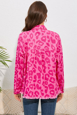Fuchsia leopard print denim shacket with fringe hem and button cuffs.
