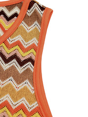 Zigzag knit two-piece set with orange trim and V-neckline.