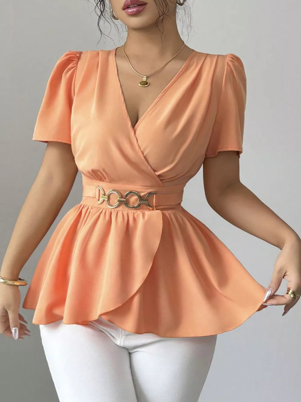 Orange polyester surplice blouse with belted waist and puff sleeves