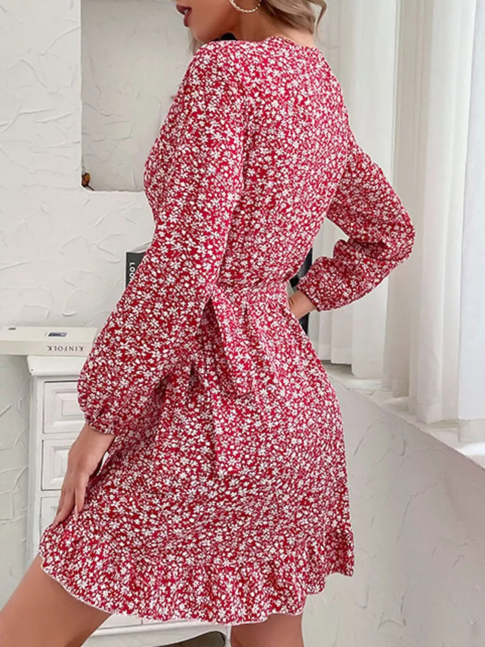 Red floral wrap mini dress with long sleeves and ruffled hem