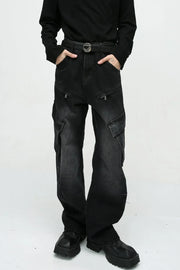 Baggy black denim cargo pants with zipper pockets and large side pockets.