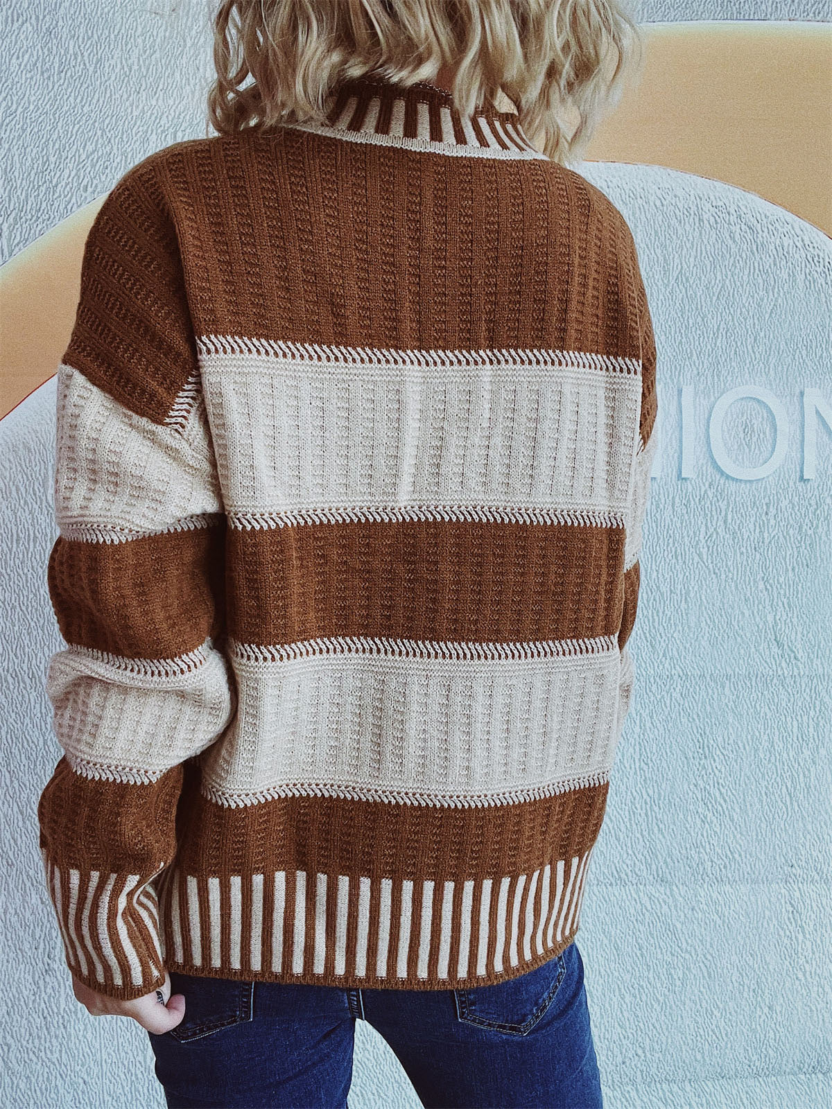 Textured stripe mock neck knit sweater in caramel and cream with ribbed details.