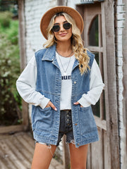 Light blue oversized denim utility vest with button front and chest pockets.