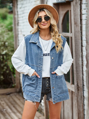 Light blue oversized denim utility vest with button front and chest pockets.