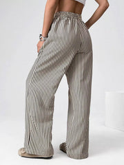 Navy striped high-waisted wide-leg pants with drawstring detail.
