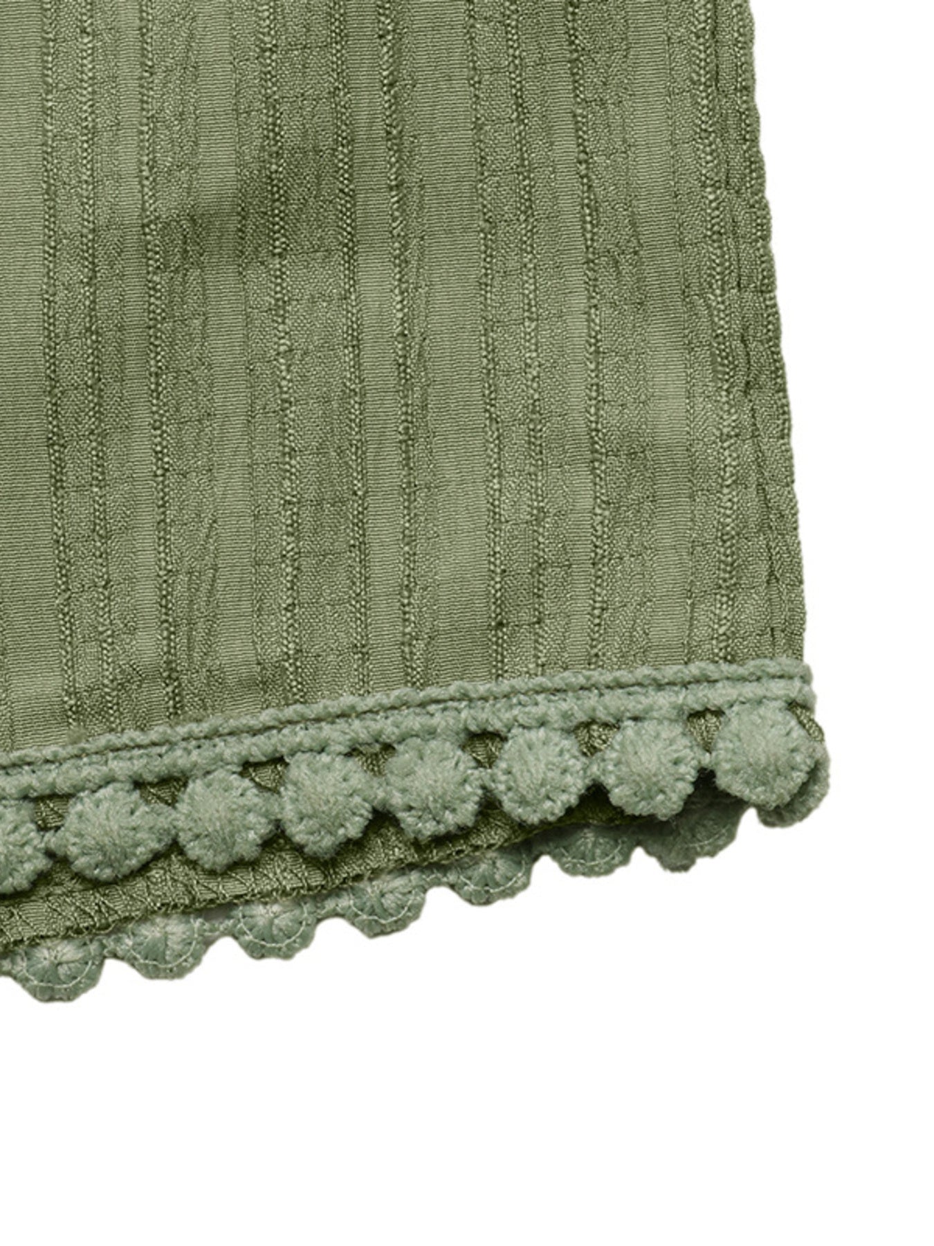 Crinkled wide-leg maternity pants in sage green with pom-pom trim detail.