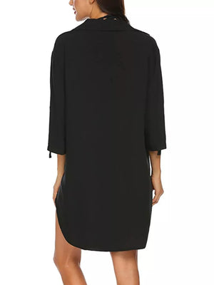 Black oversized collared shirt with 3/4 sleeves and side slits, polyester.