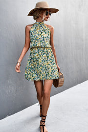 Yellow green floral halter neck mini dress with smocked waist