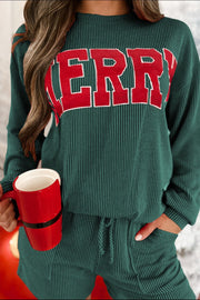 Textured ribbed loungewear set in black with "Merry" graphic on top and drawstring shorts.