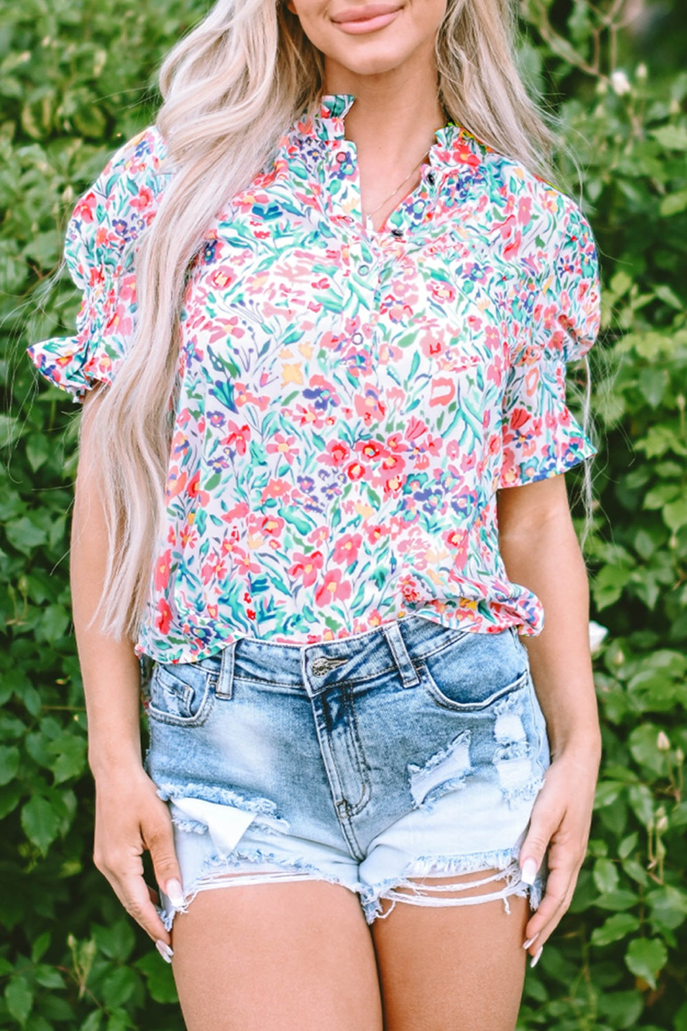 Floral ruffle collar puff sleeve blouse with a colorful floral print.