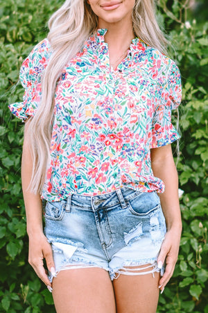 Floral ruffle collar puff sleeve blouse with a colorful floral print.