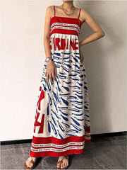 Spaghetti strap maxi dress with blue sardine print and red trim.