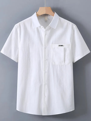 Classic short-sleeve button-up shirt in white with a chest pocket and subtle vertical texture.
