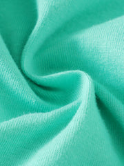 Close up of soft teal cotton fabric with visible knit texture.